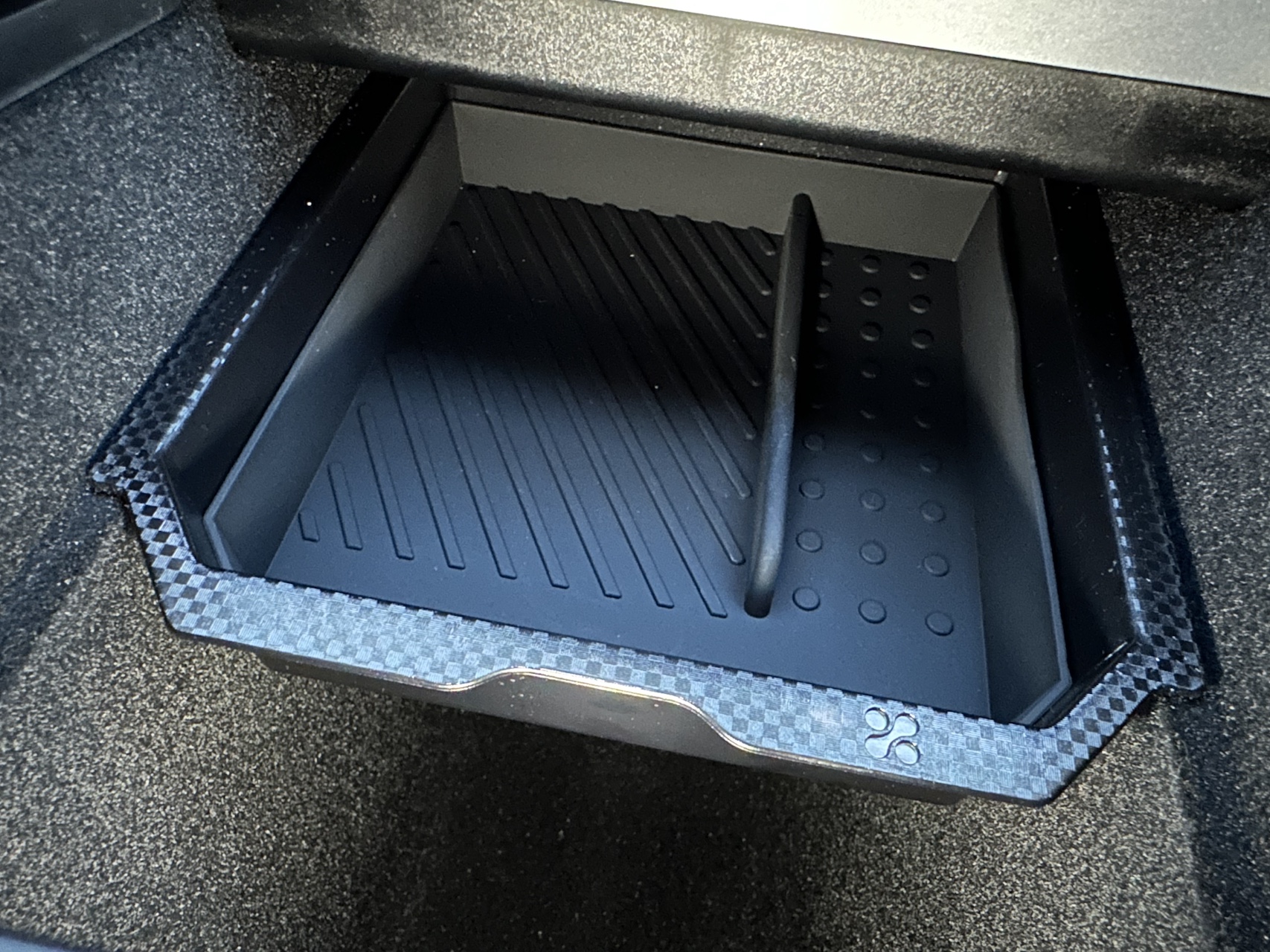 Tesla Model Y console organizer tray installed in the lower storage area