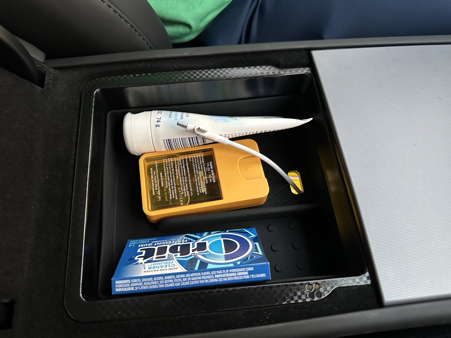 Tesla Model Y upper console tray holding small daily carry items
