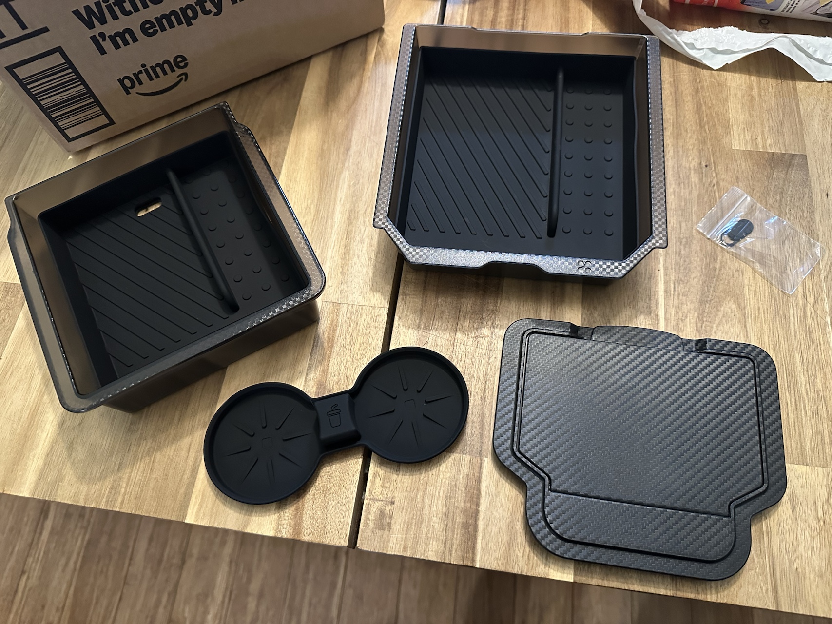 Model Y organizer tray kit pieces before installation